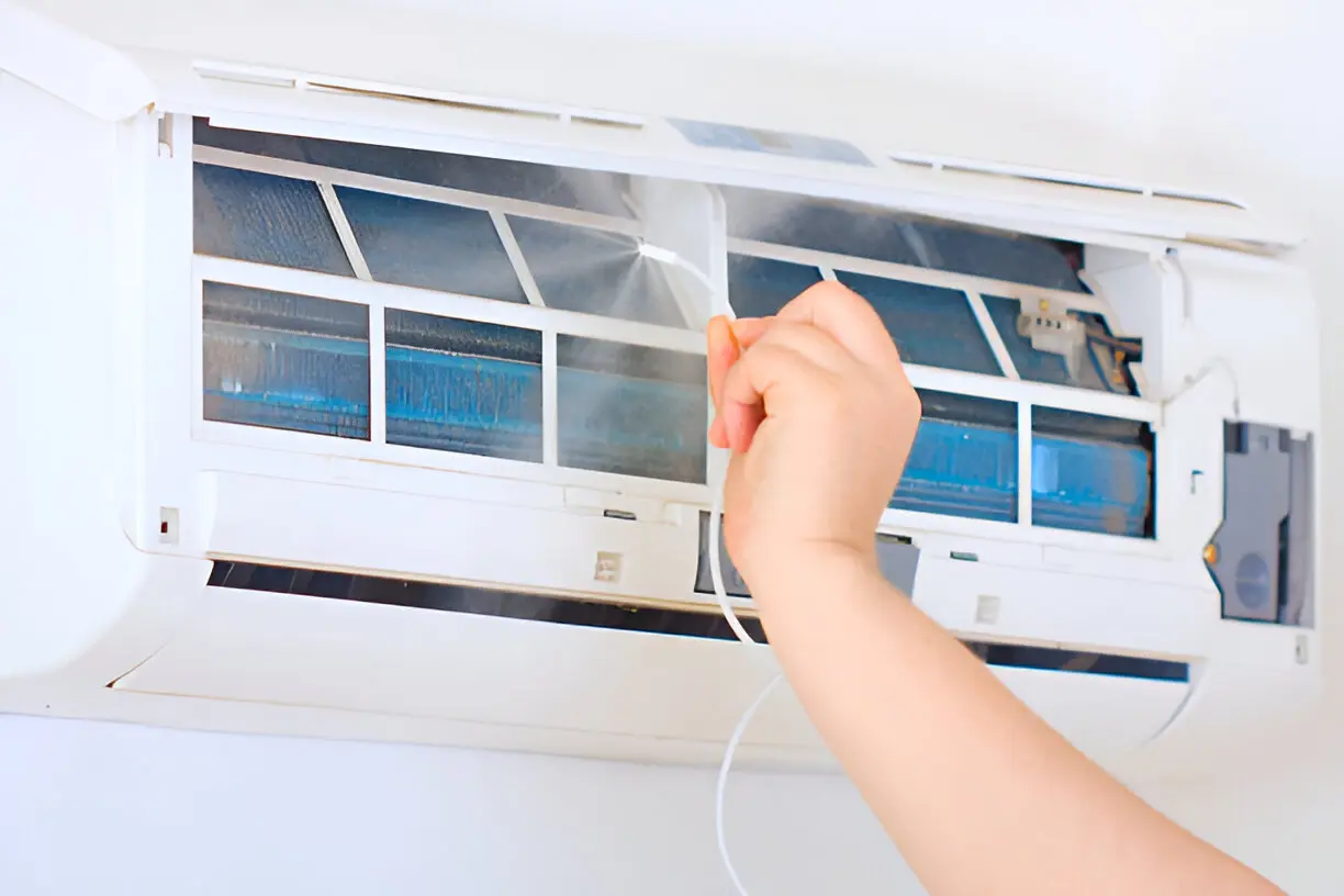 Technician providing professional air conditioning service for a residential home in Orlando