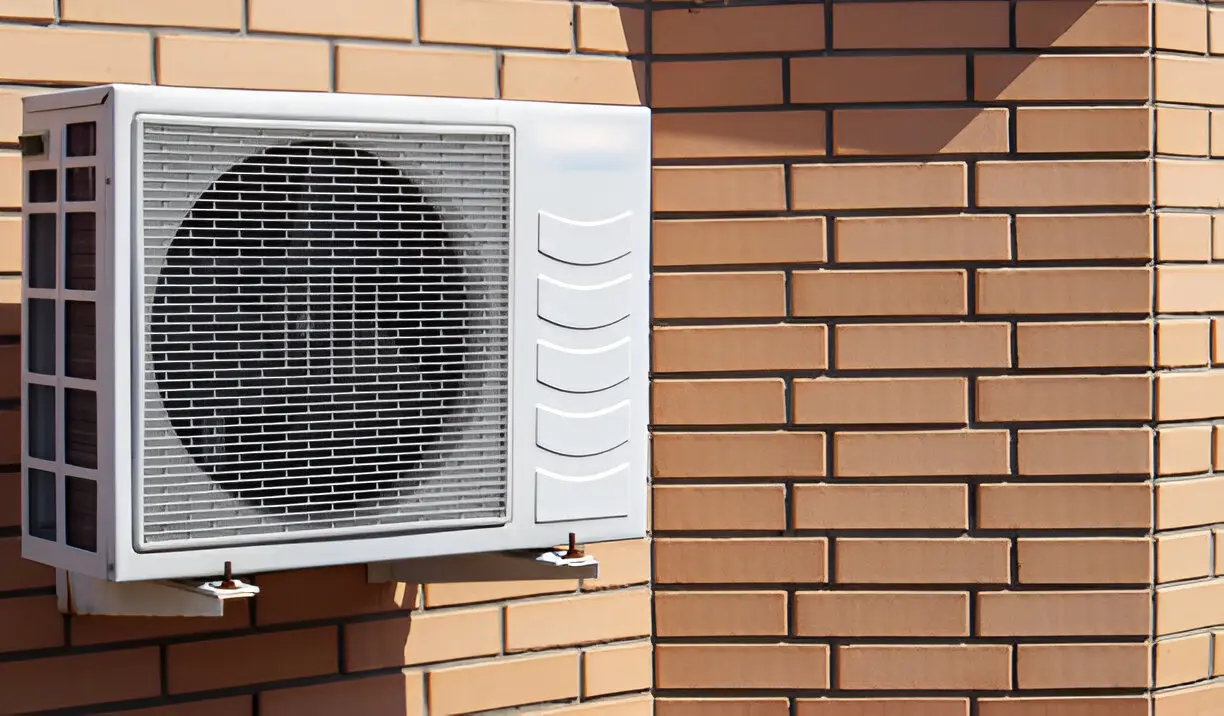Air Conditioning Contractor in Orlando performing routine AC maintenance on a home unit